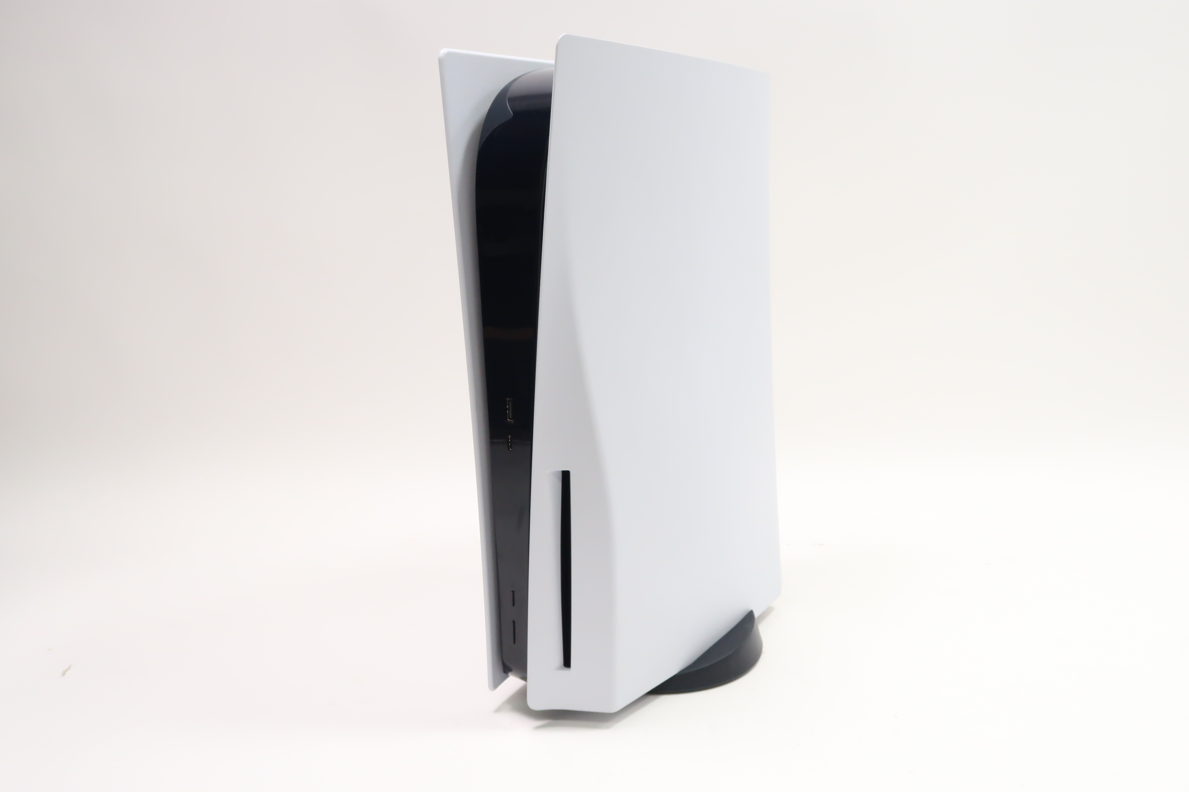 Angled front view of White PlayStation 5 Disc Edition Console